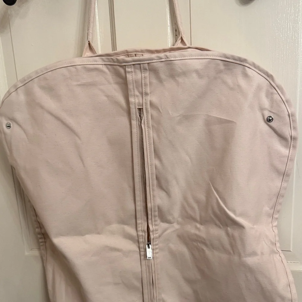 New McQueen Cream Garment Bag with hanger